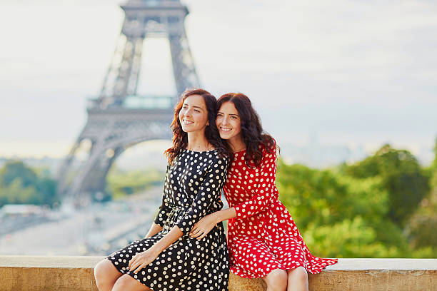 istock Twin sisters in front of the Eiffel tower in Paris 516264710