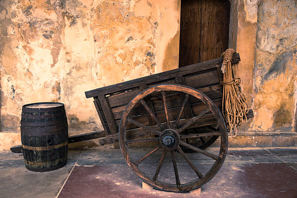 istock Old wooden cart and barrel. 516265602