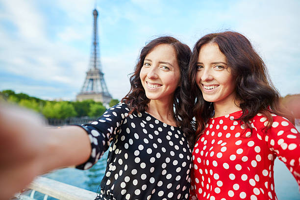 istock Twin sisters in front of the Eiffel tower in Paris 516265636