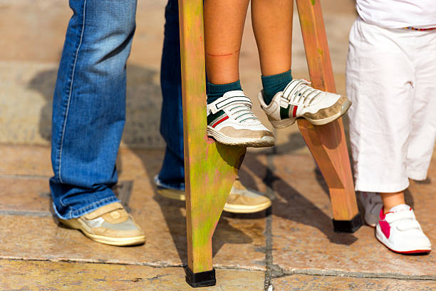 istock Child on Wooden Stilts 516280031