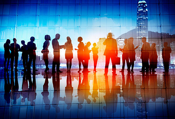 istock Silhouettes of Business People Working 516280281