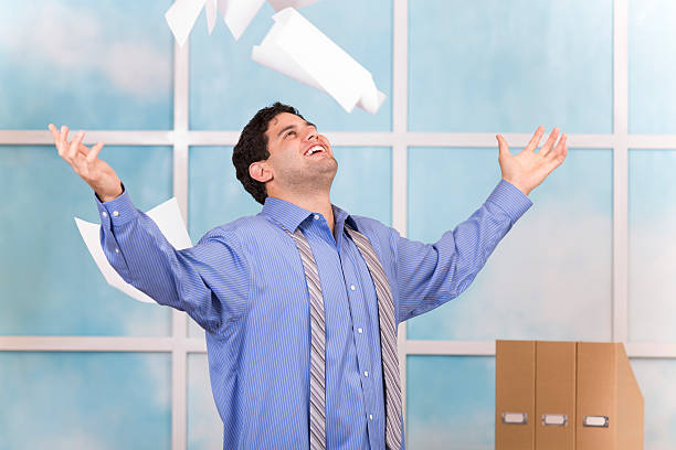 istock Freedom! Excited business man throws papers in air. Office. 516280449
