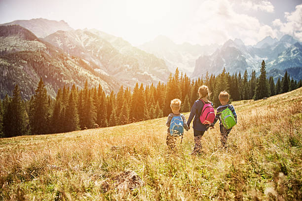 istock Kids hiking in the mountains 516280487