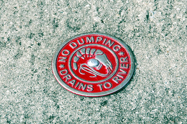 istock No Dumping marker affixed to sidewalk in South Carolina 516281327
