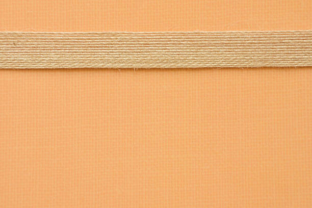 A ribbon border colored paper that can be used as a background for scrapbooking, cards, or invitations.
