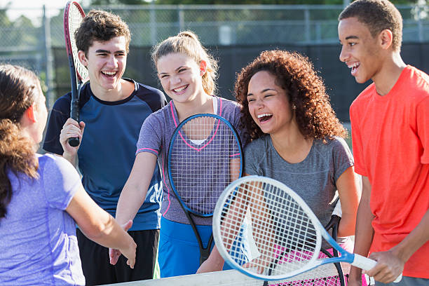 istock Teenagers playing tennis 516281913