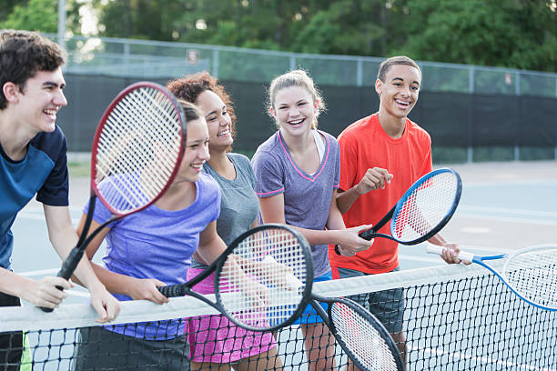 istock Teenagers playing tennis 516281919