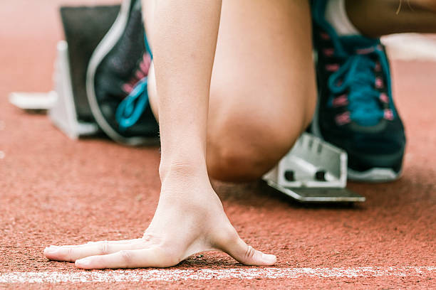 istock Close up view of a female sprinter ready to go 516281923
