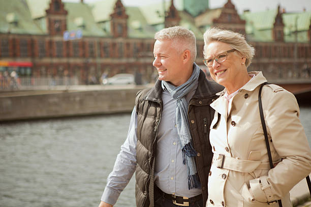 Senior couple in a city. Cheerful senior couple in the city centre of Copenhagen, Denmark. danish culture stock pictures, royalty-free photos & images