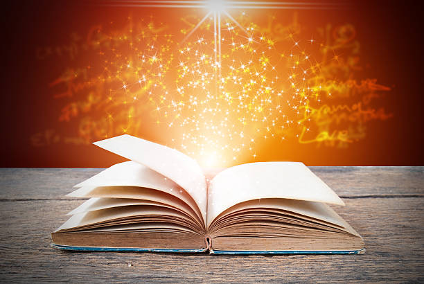istock Abstract magic book on wooden background 516284648