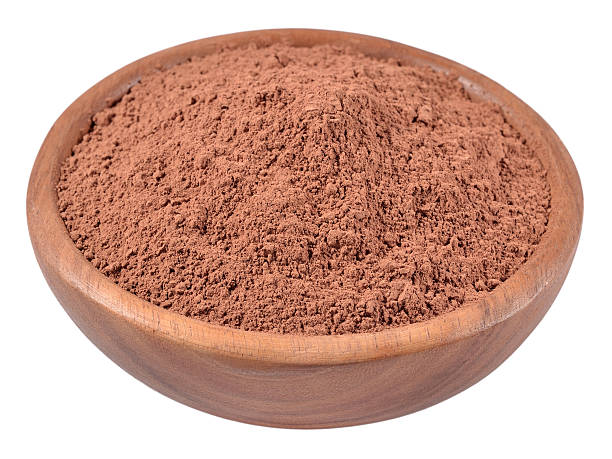 istock Cocoa powder in a wooden bowl on a white 516284881