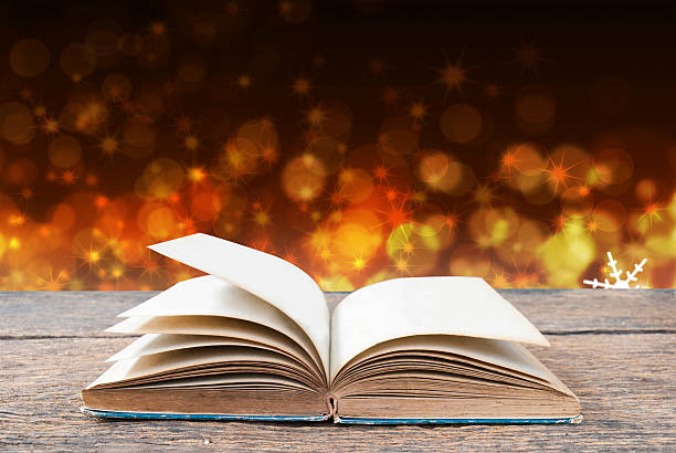 istock Abstract magic book on wooden background 516285052