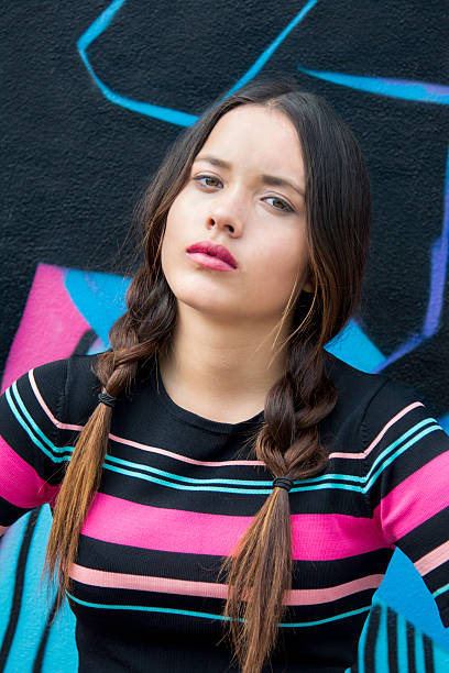 Rebellious teen looking sad and down-hearted Olive skinned rebellious teen looks sad and down-hearted maori weaving stock pictures, royalty-free photos & images