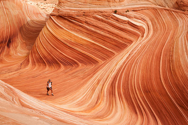 Woman hikes through a Wave in Arizona stock photo