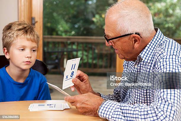 Grandfather And Grandson Math Quiz With Flashcards Stock Photo - Download Image Now - Flash Card, Multiplication, Mathematical Symbol