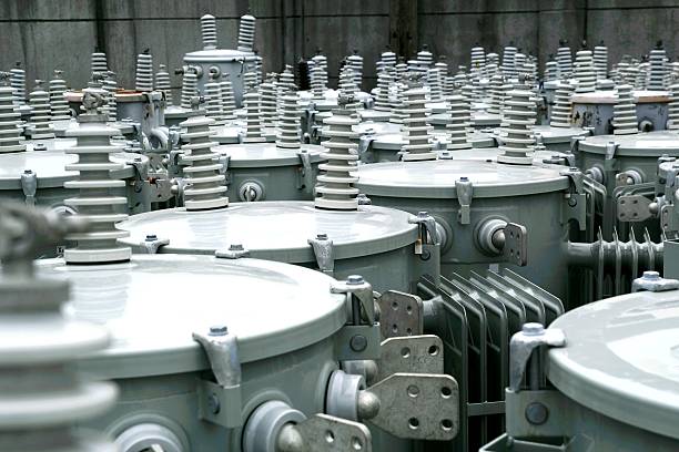 Electric transformers Photo of electric transformers at a stock yard electricity transformer photos stock pictures, royalty-free photos & images