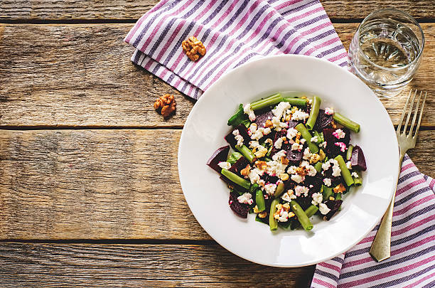 istock salad with roasted beets, green beans, walnuts and goat cheese 516286687