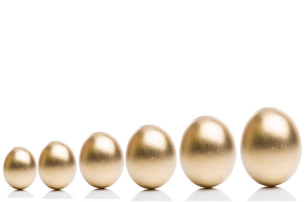 istock Golden eggs from  isolated on a white background. 516286962