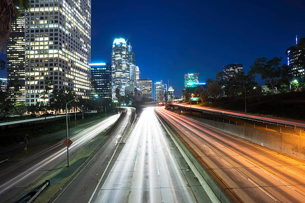 istock traffic through urban with sunset in los angle 516289336