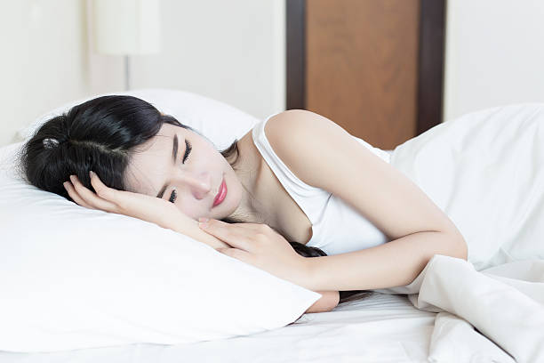 istock young beautiful woman sleeping on bed 516290466