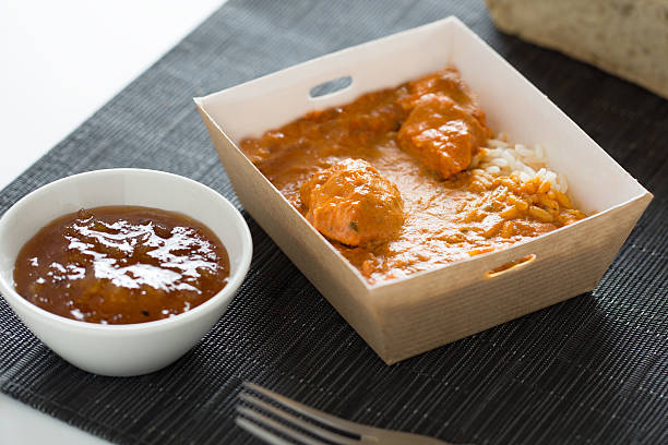 istock Chicken tikka with rice in a box 516290926