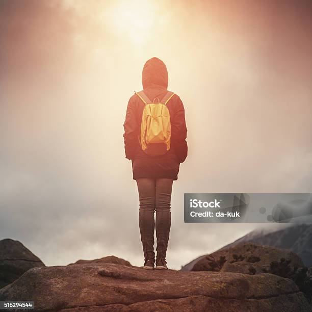 Traveler With Backpack Walking In Mountains At Sunset Stock Photo - Download Image Now