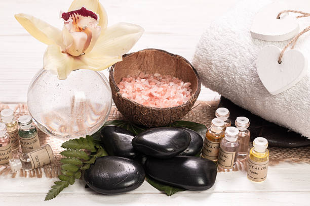 istock spa concept with stones, flowers , essential oils and mineral salt 516294600