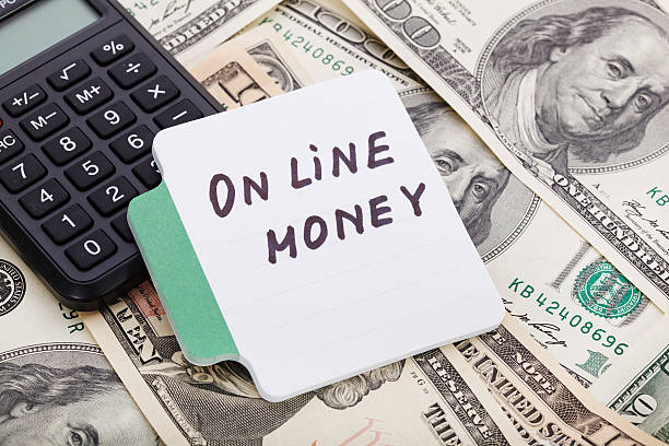 istock Concept write - On line money. Sign lays on calculator 516296078