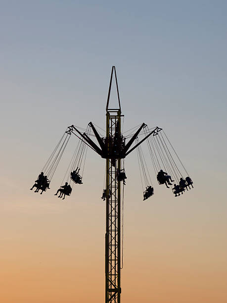 istock Amusement Park Carnival Ride at Dusk 516313831