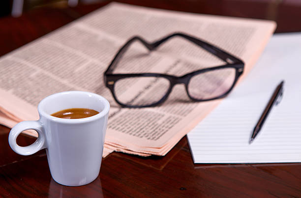 istock Cup of Coffee and Newspaper 516313887