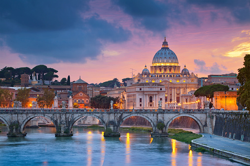 View of St. Peter's cathedral in Rome, Italy during beautiful sunset.