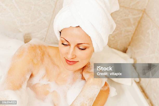 Woman Ejoying Bubble Bath Stock Photo - Download Image Now - 30-39 Years, Adult, Adults Only