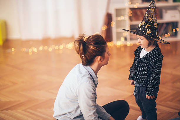 istock Little witch and mom 516315293