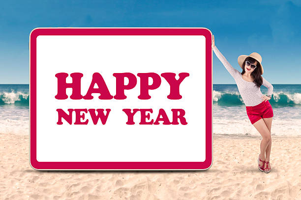 2025 written on sandy beach