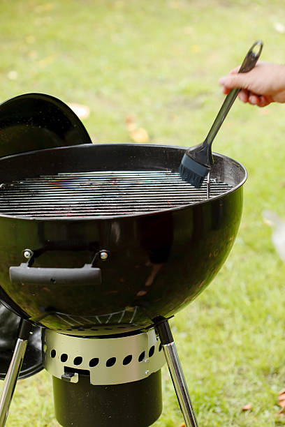 istock man getting the grill ready for some cooking 516315685