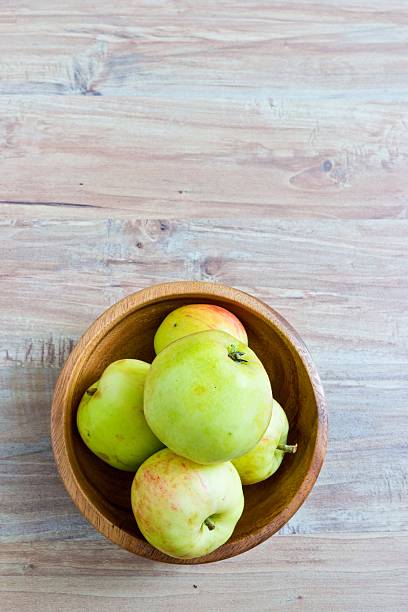 istock Fresh apples in wooden bowl 516316039