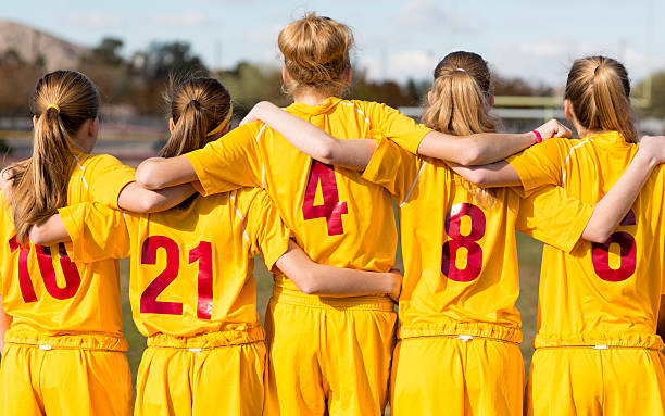 As One Players from a young soccer club are united with one purpose: Teamwork. high school soccer stock pictures, royalty-free photos & images