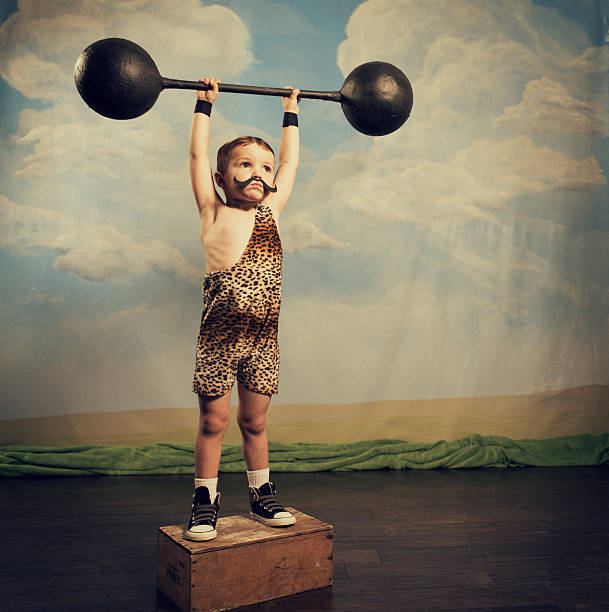 Muscle Master A young dead lifter has mastered gravity. You never know how far you can go until you try. clean and jerk stock pictures, royalty-free photos & images