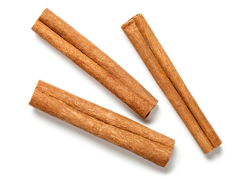 Cinnamon sticks on white background. Top view