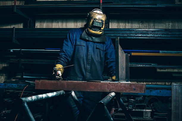 istock Welder with mask in workplace 516317038