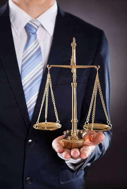 istock Businessman Holding Justice Scale 516318471