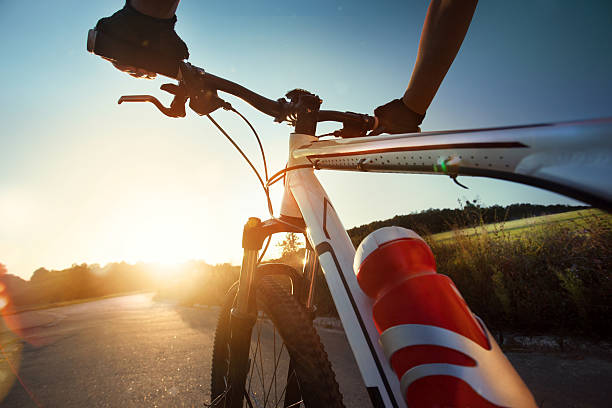 istock Hands in gloves holding handlebar of a bicycle 516318721