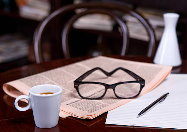 istock Cup of Coffee and Newspaper 516318739