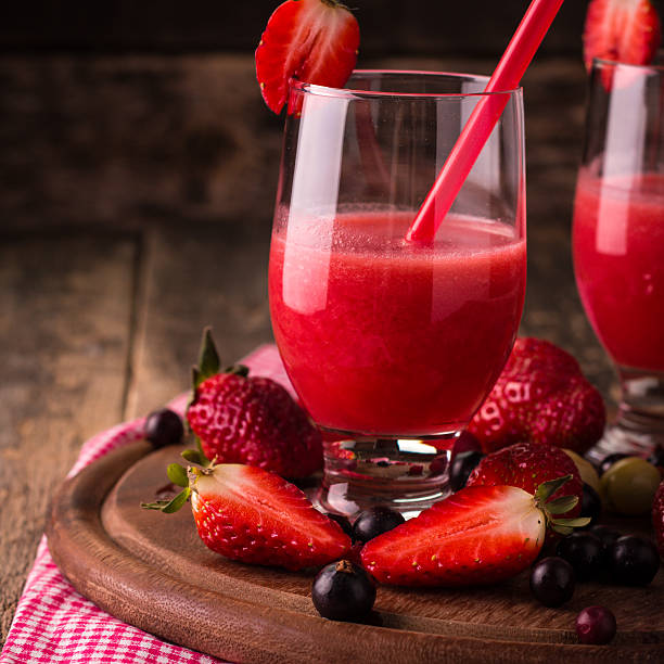 istock fresh smoothie with fruit and berries, on wooden background 516319772