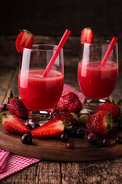 istock fresh smoothie with fruit and berries, on wooden background 516319816
