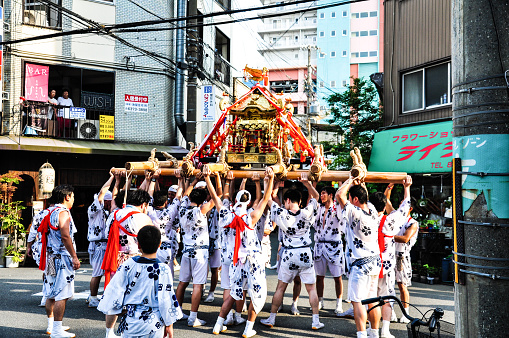 Osaka, Japan - July 25, 2012: Golden portable shrine carried and worshipped by participants of the Tenjin Matsuri Festival, the greatest festival in Osaka boasting of a history of a thousand years.