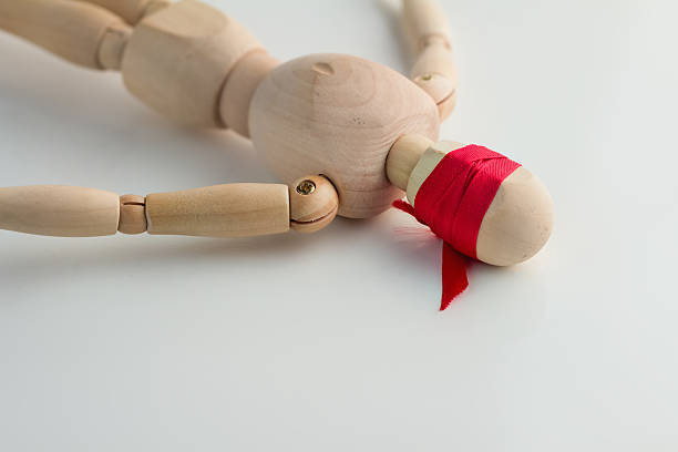 istock blind wooden figure on the white floor 516322928