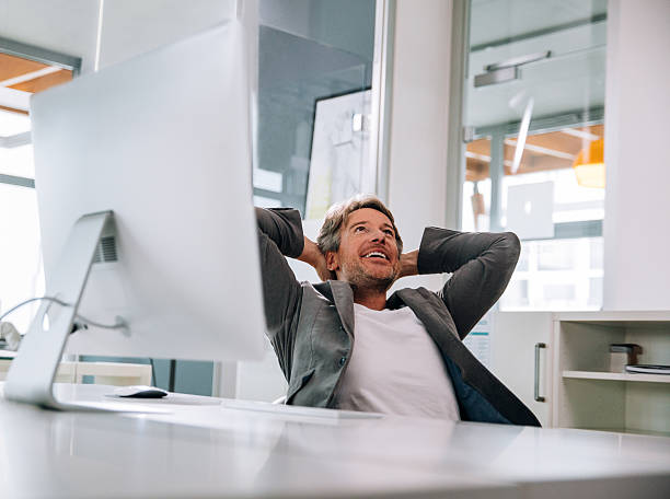 istock Executive business man leaning back desk relaxing after successful work. 516323892