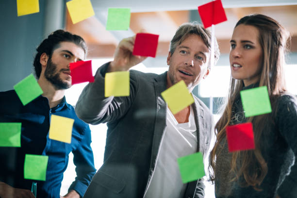 istock Team leader pointing out  good concept in the brainstorming session 516324800