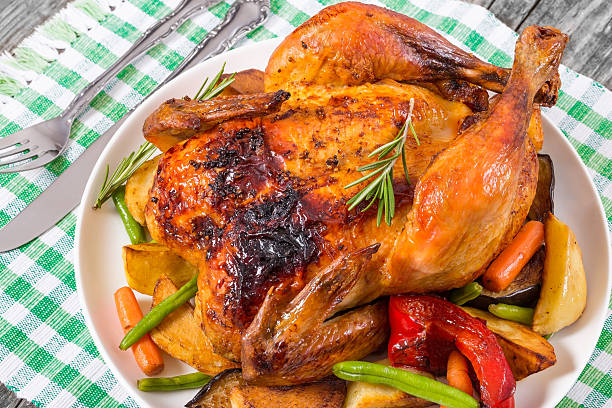 istock Roasted whole chicken, potatoes, baby carrots, eggplants, green 516325028